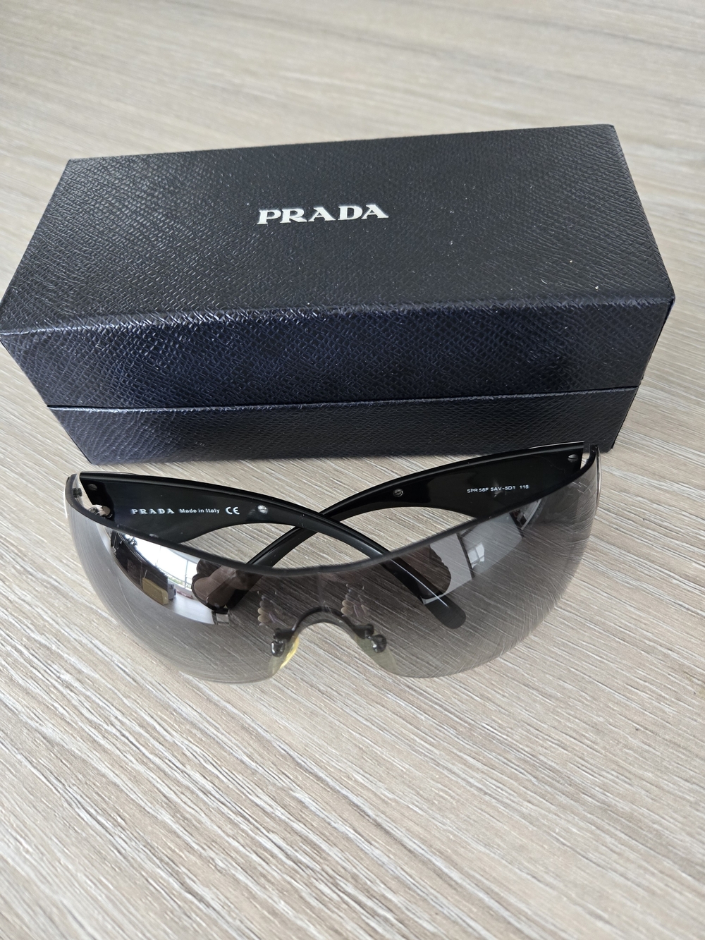 PRADA Unisex Black Shield Sunglasses with Silver Wave Design On Arms